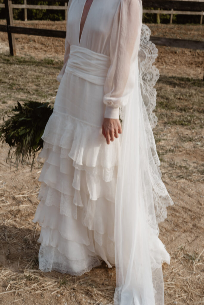 Claudia Aurell wearing a natural silk wedding dress by L'Arca Barcelona