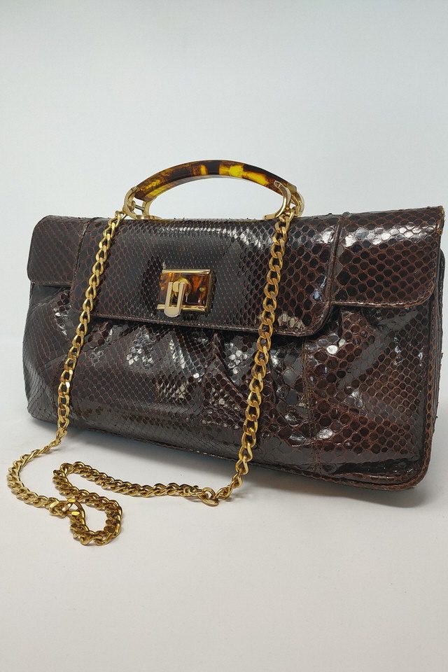 Elegant vintage snakeskin handbag with a tortoiseshell style  handle